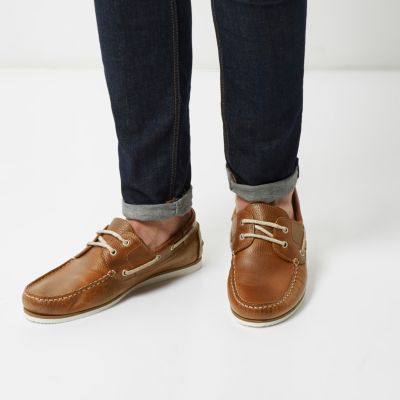Tan leather boat shoes